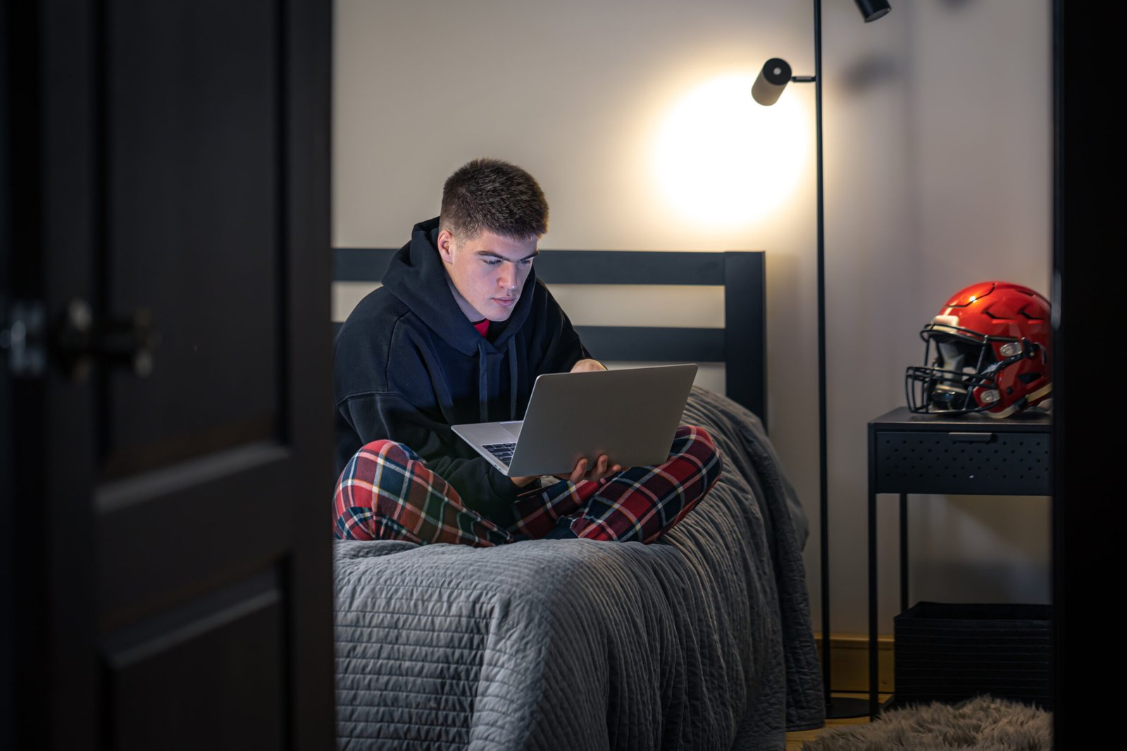 teenager guy using laptop